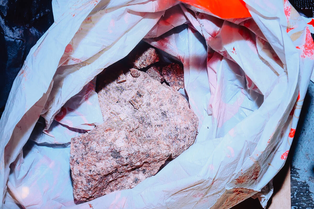 Rocks used as weapons are shown during a briefing on a police shooting at Metropolitan Police H ...