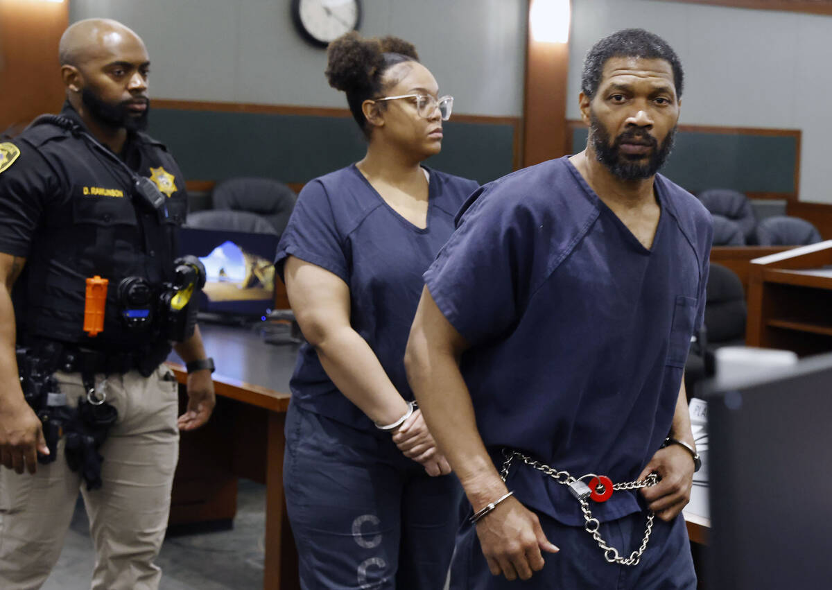 Antwone Washington, left, a high school football coach, who pleaded guilty to two felonies afte ...