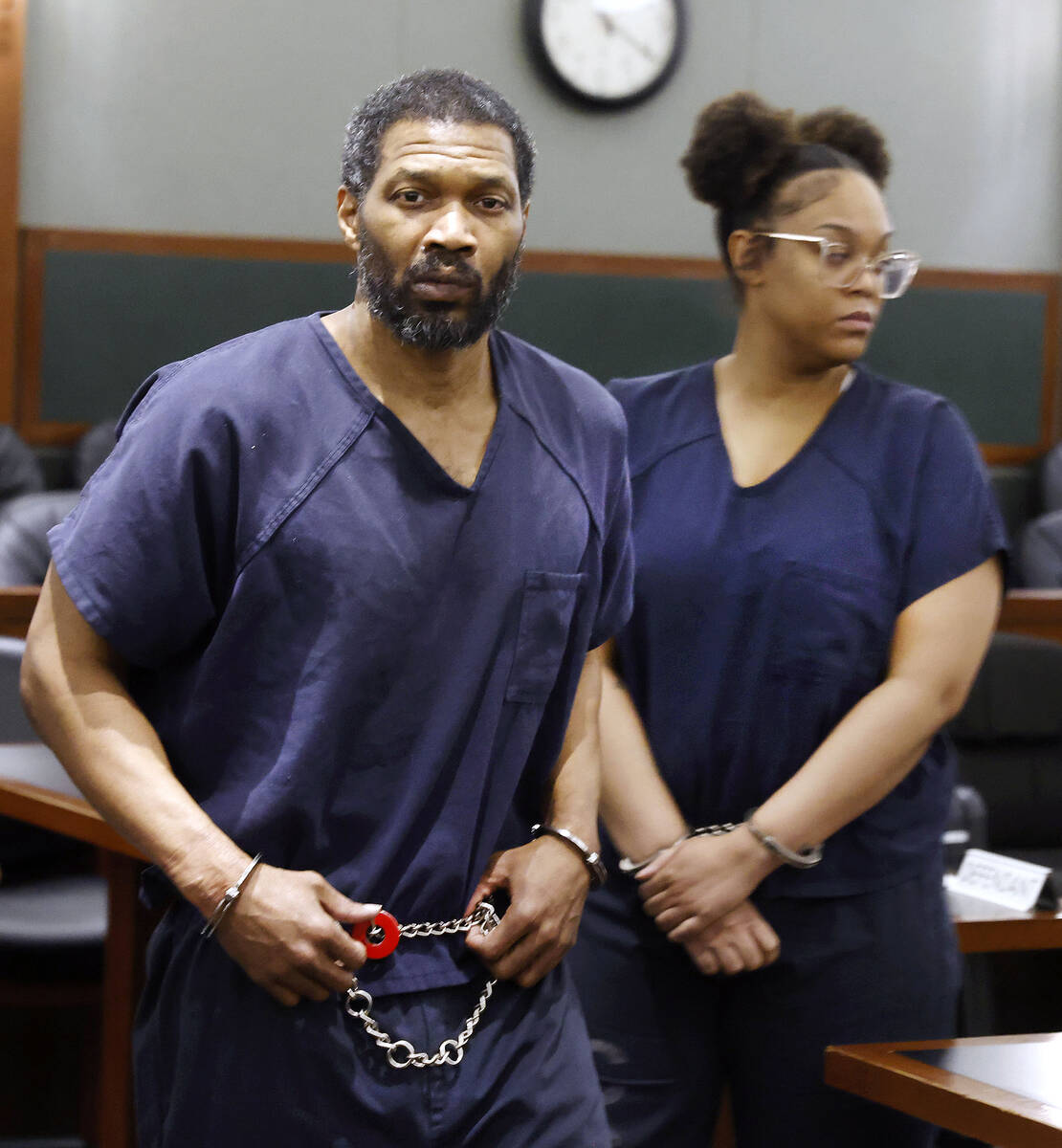 Antwone Washington, left, a high school football coach, who pleaded guilty to two felonies afte ...