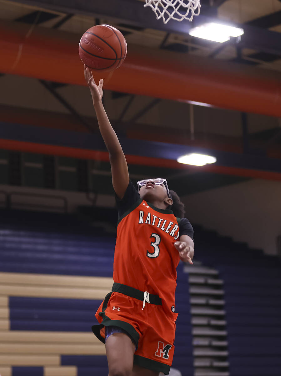Mojave’s Jordyn Carroll lays up the ball during a basketball game at Shadow Ridge High S ...