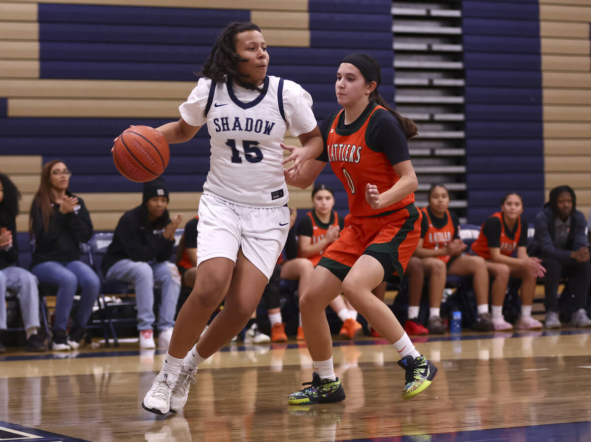 Shadow Ridge forward Naveah Trochie (15) drives to the basket against Mojave’s Isabella ...