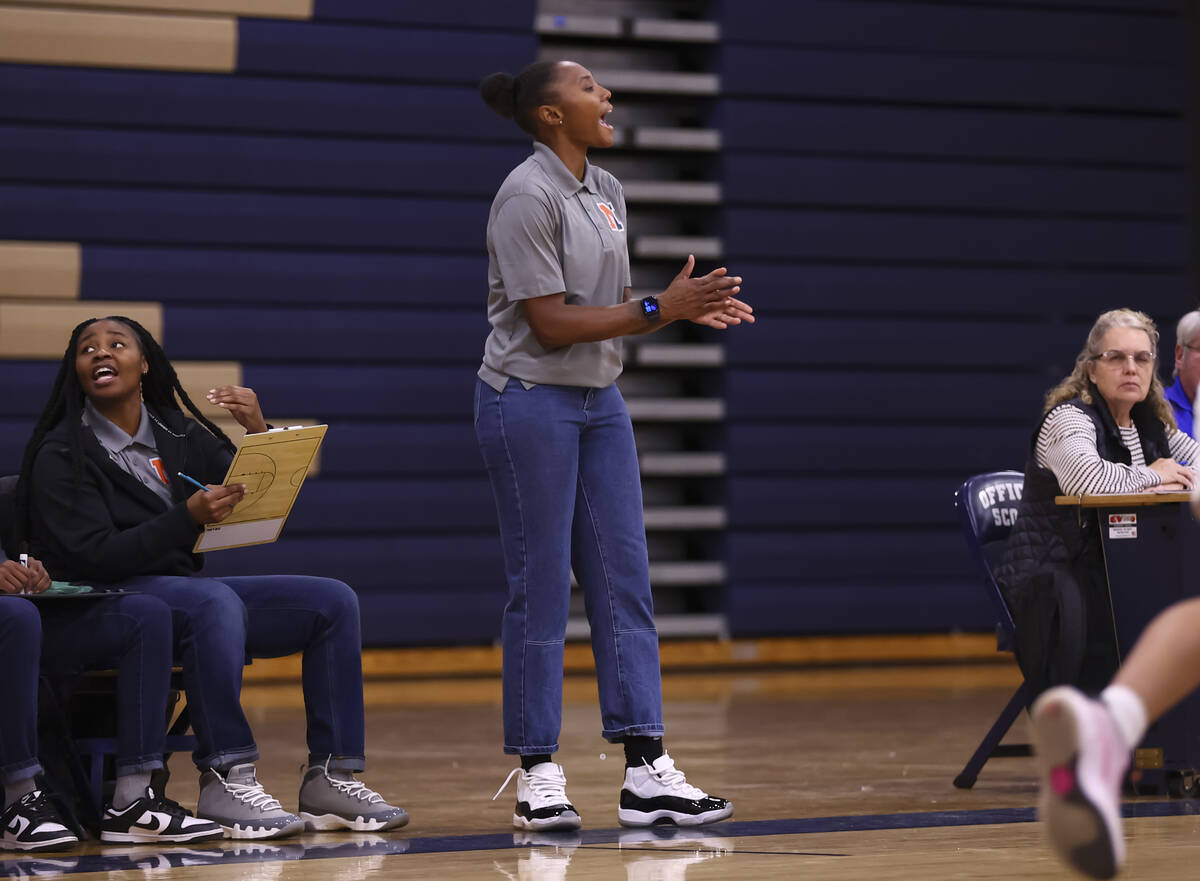 Mojave coach Sequoia Holmes directs her team during a basketball game at Shadow Ridge High Scho ...