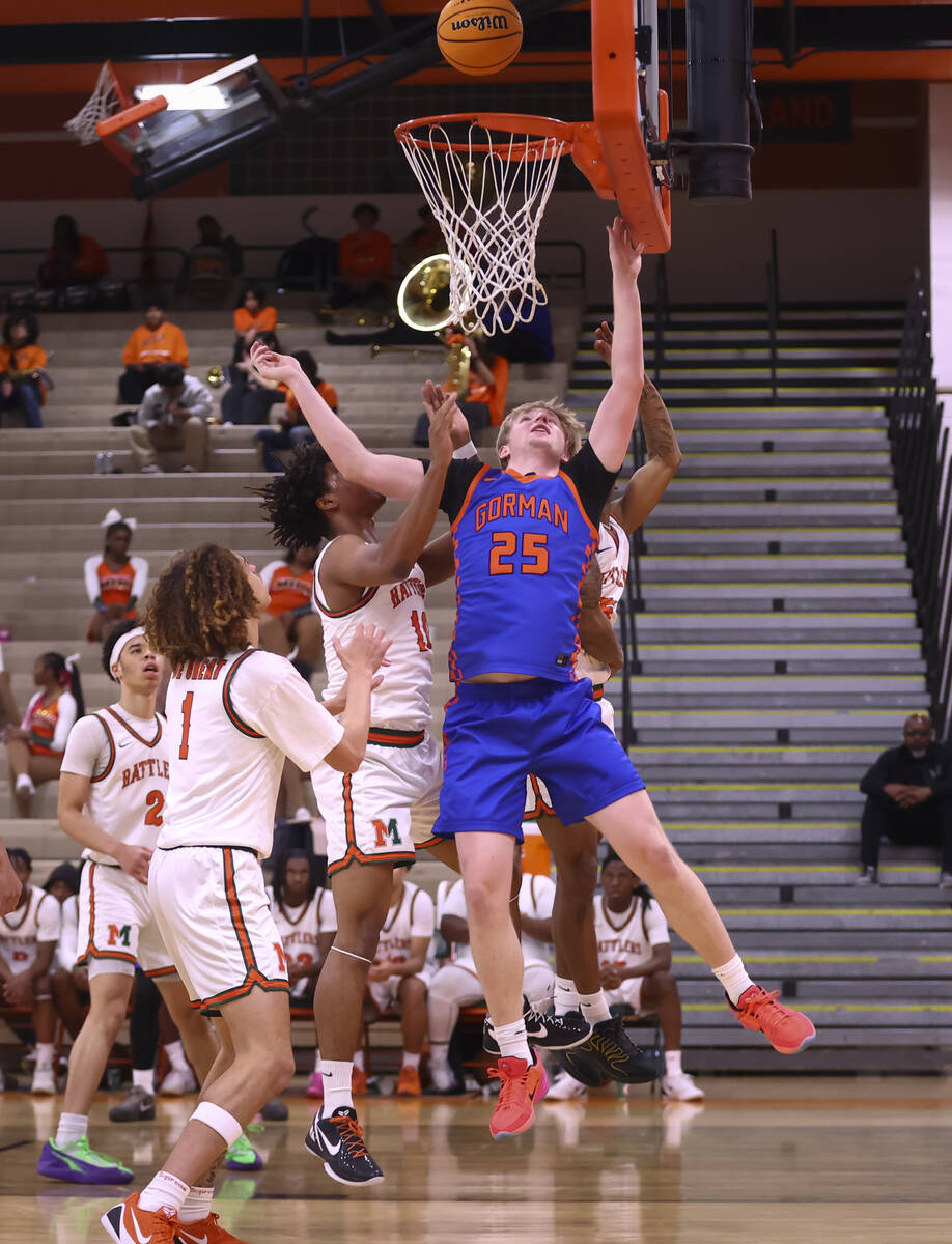 Bishop Gorman center Tyler Bright (25) lays up the ball against Mojave forward Ty'jir Brox ...