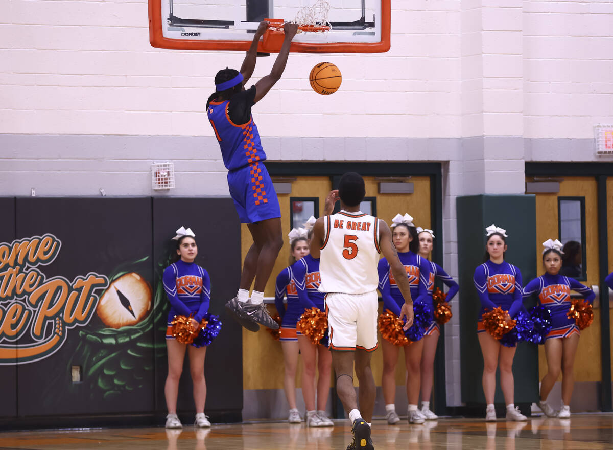 Bishop Gorman guard Ty Johnson (1) dunks the ball during a basketball game at Mojave High Schoo ...