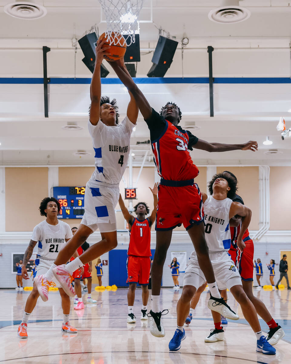 Democracy Prep wing Jaden Redding (4) and Coronado power forward Siyahe Siaisiai (35) compete f ...
