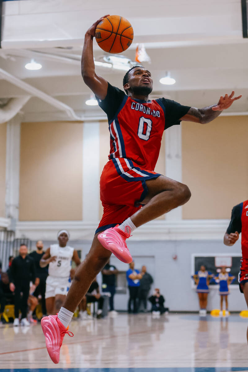 Coronado guard Jonny Collins (0) leaps up toward the basket during the basketball game on Wedne ...