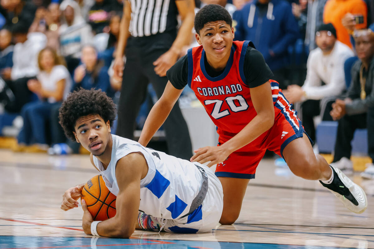 Democracy Prep guard Mario Allen (12) and Coronado guard Graceson Snow (20) look to the ref for ...