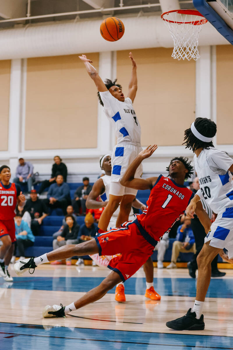 Coronado guard/wing Munir Greig (1) falls after attempting a layup during the basketball game o ...