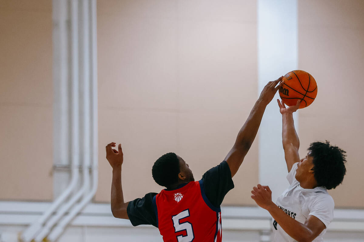 Coronado wing DeVaughn Dorrough (5) and Democracy Prep wing Jaden Redding (4) tip off at the st ...