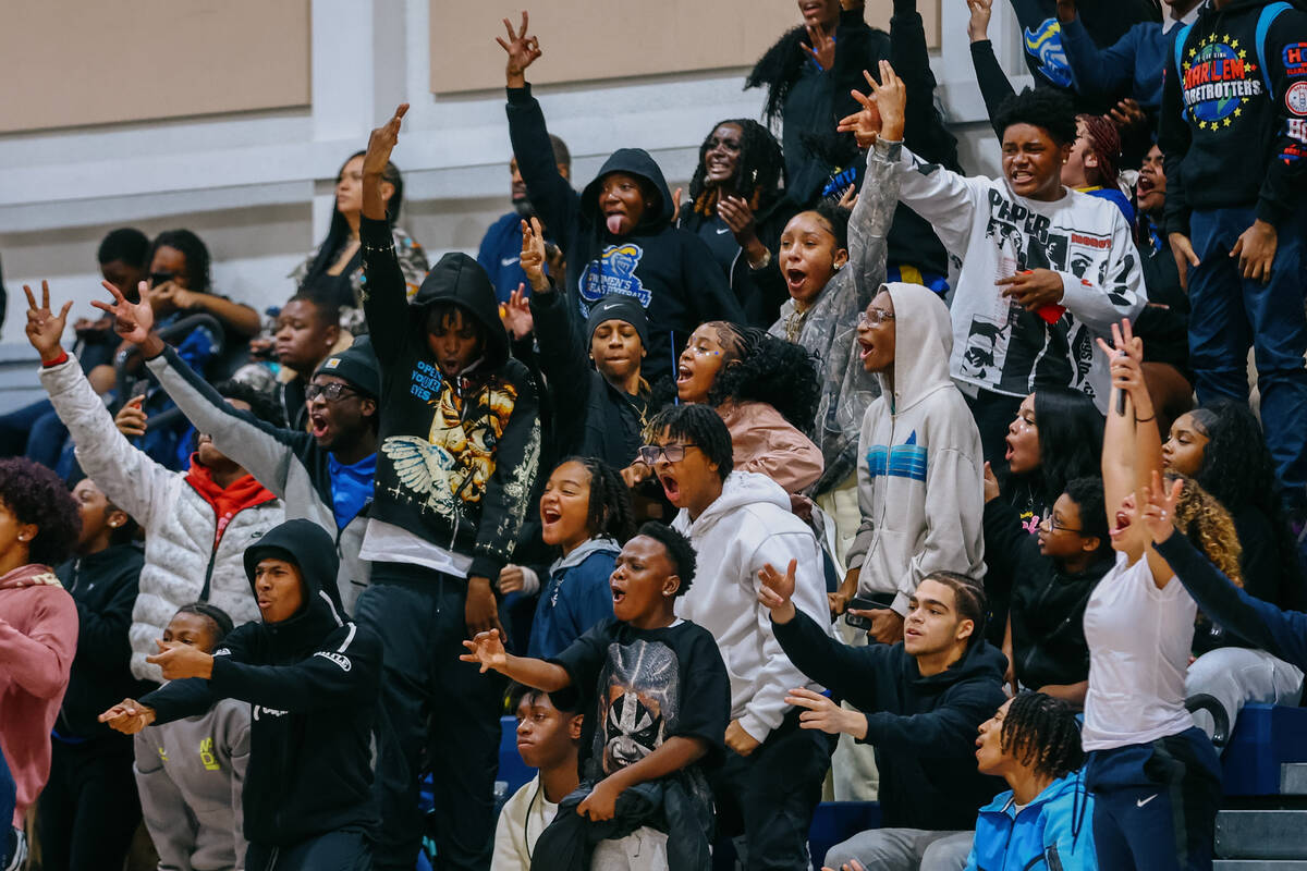 The Democracy Prep student section erupts after the Blue Knights scored a three-pointer during ...