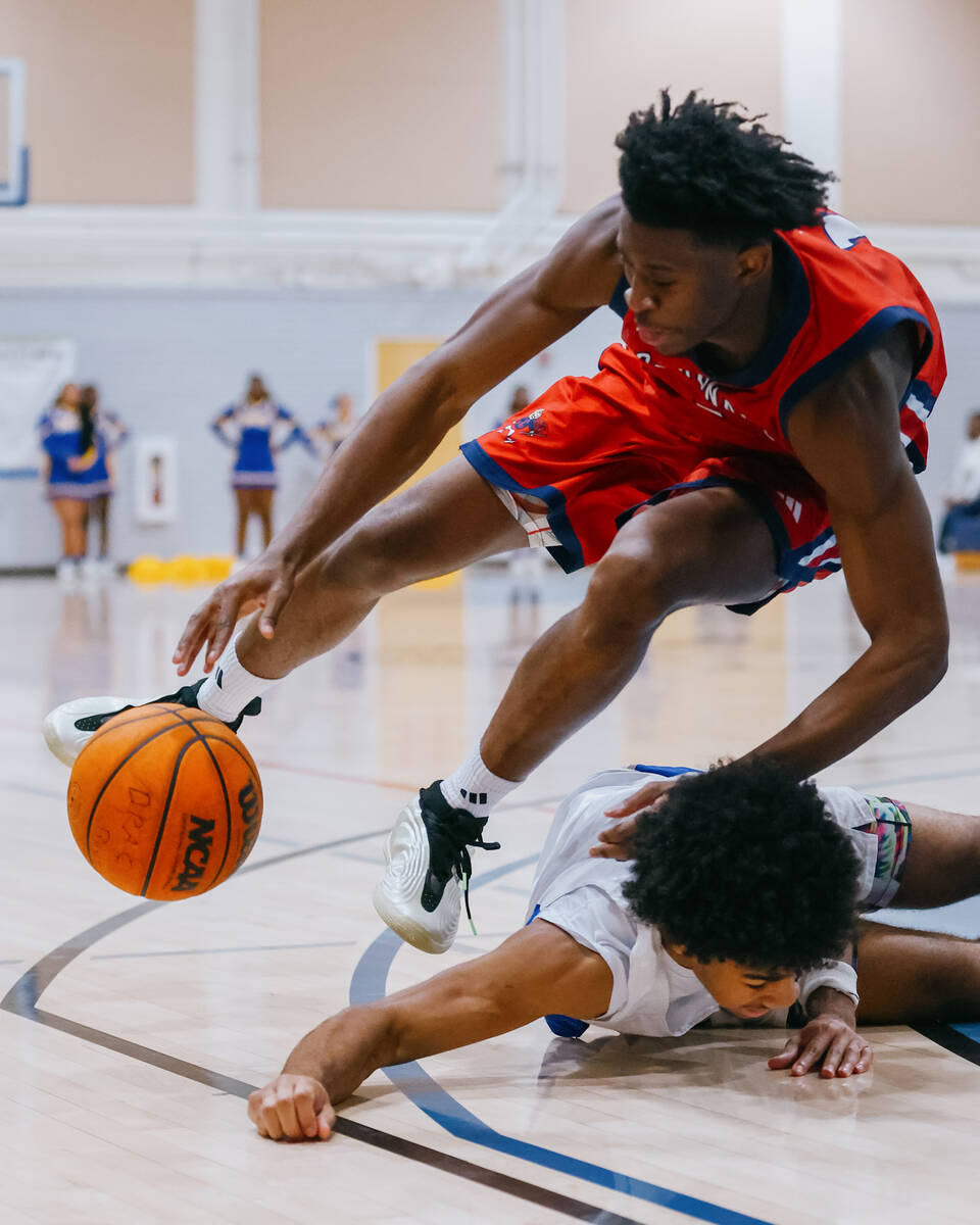 Coronado guard/wing Munir Greig (1) and Democracy Prep guard Mario Allen (12) trip over each ot ...