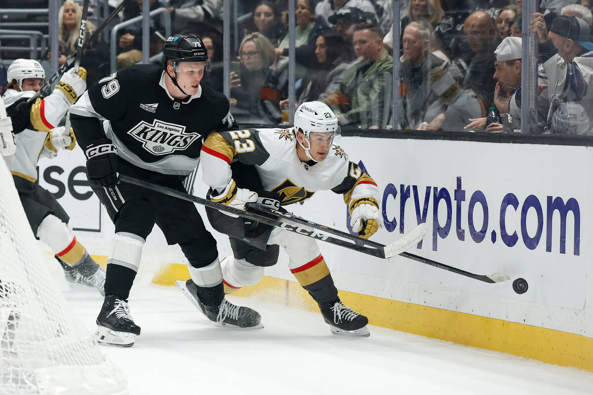 Vegas Golden Knights left wing Cole Reinhardt (23) reaches for the puck as Los Angeles Kings ce ...
