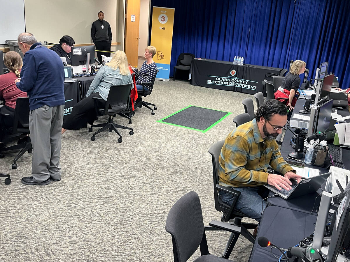 Chief Deputy District Attorney Jake Villani, seated in foreground, files last minute to run for ...