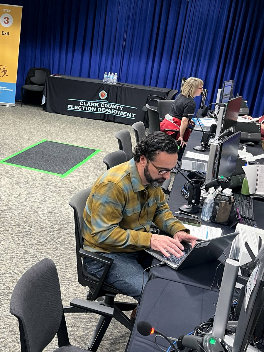 Chief Deputy District Attorney Jake Villani, seated in foreground, files last minute to run for ...