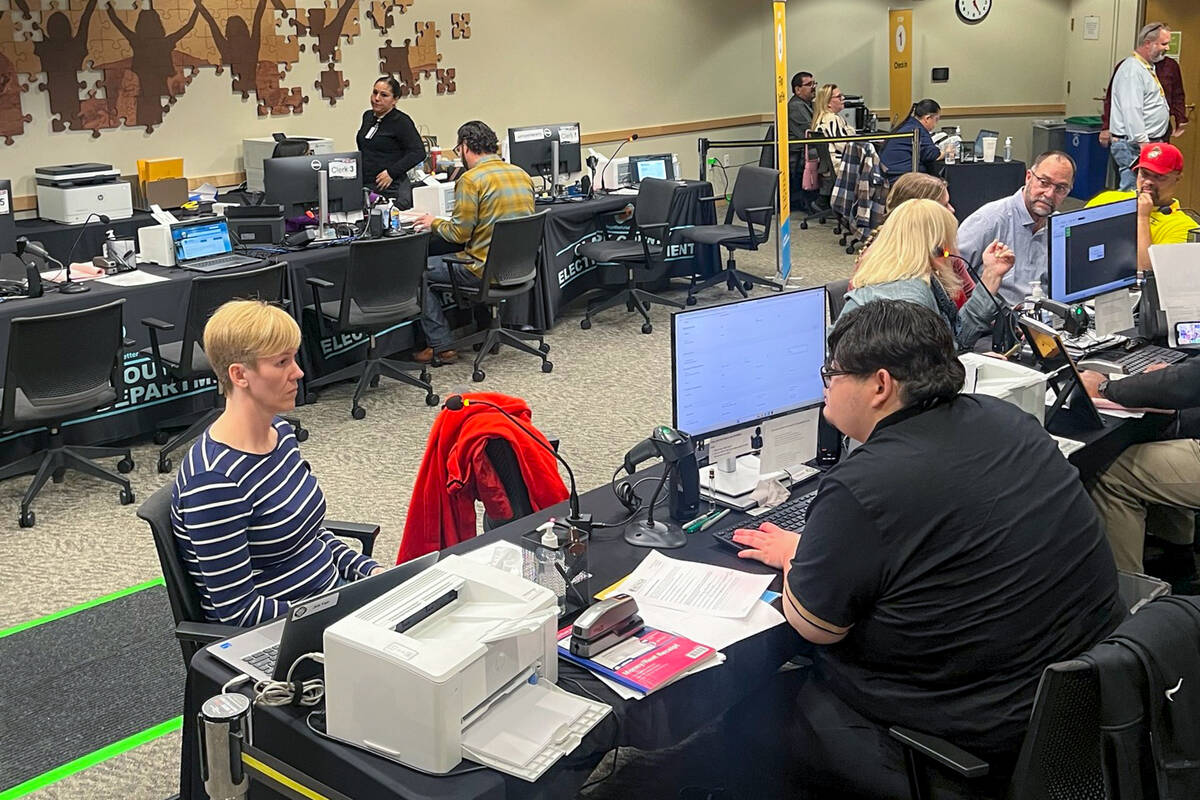 Attorney Marilyn Caston, seated at left, files to run for Family Court Department R on Friday, ...