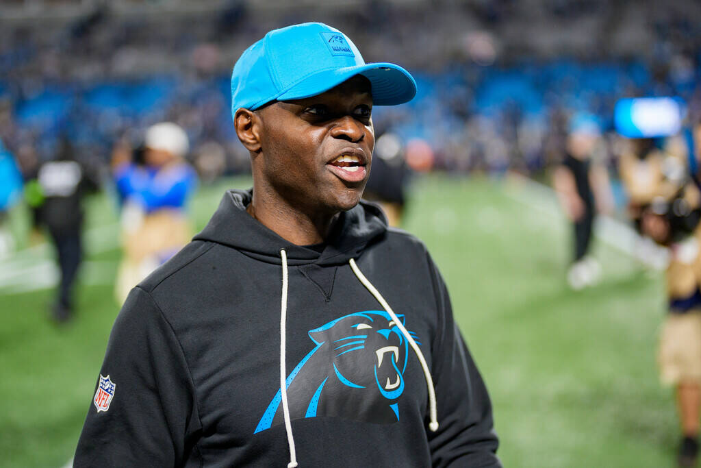 Carolina Panthers defensive coordinator Ejiro Evero walks off the field after losing to the Los ...