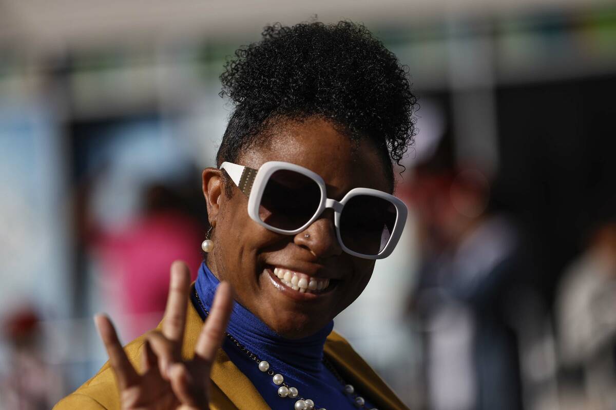 Dione Gantt, with Sigma Gamma Rho sorority, waves to the crowd during the Dr. Martin Luther Kin ...