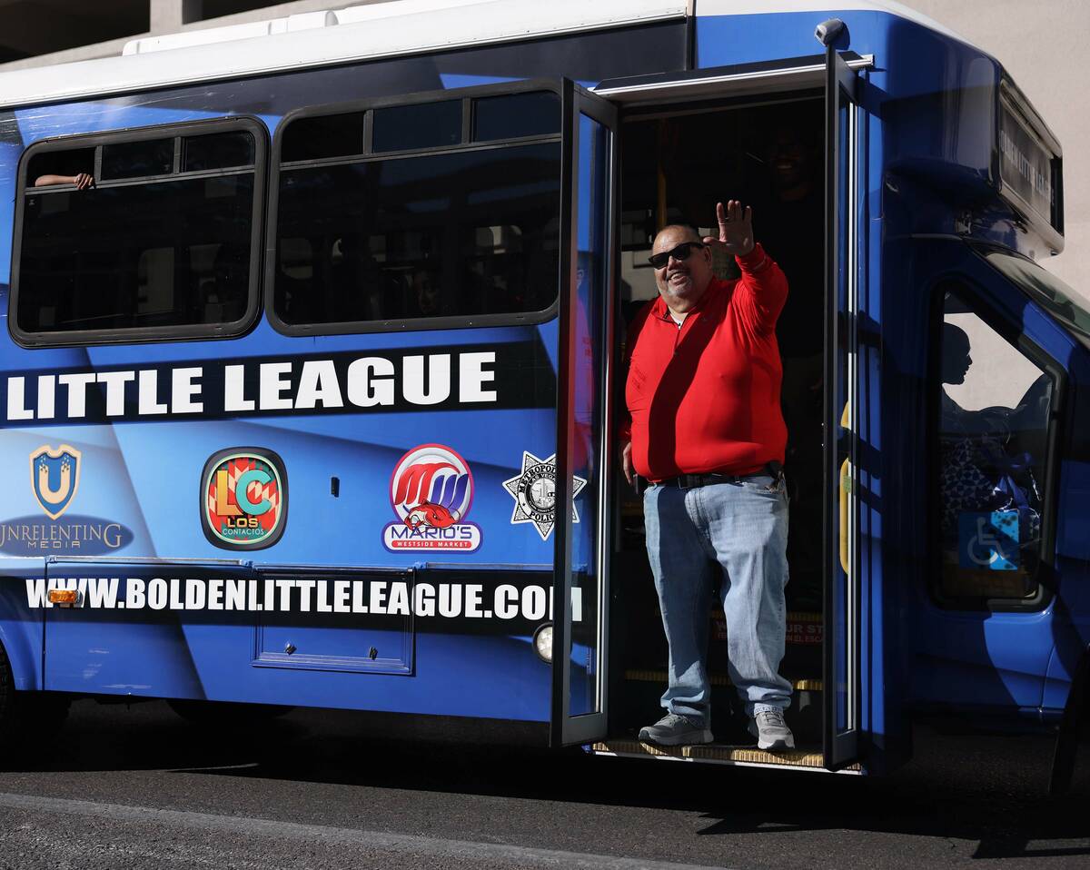 Mario Berlanga, owner of Mario's Westside Market, waves to the crowd during the Dr. Martin Luth ...