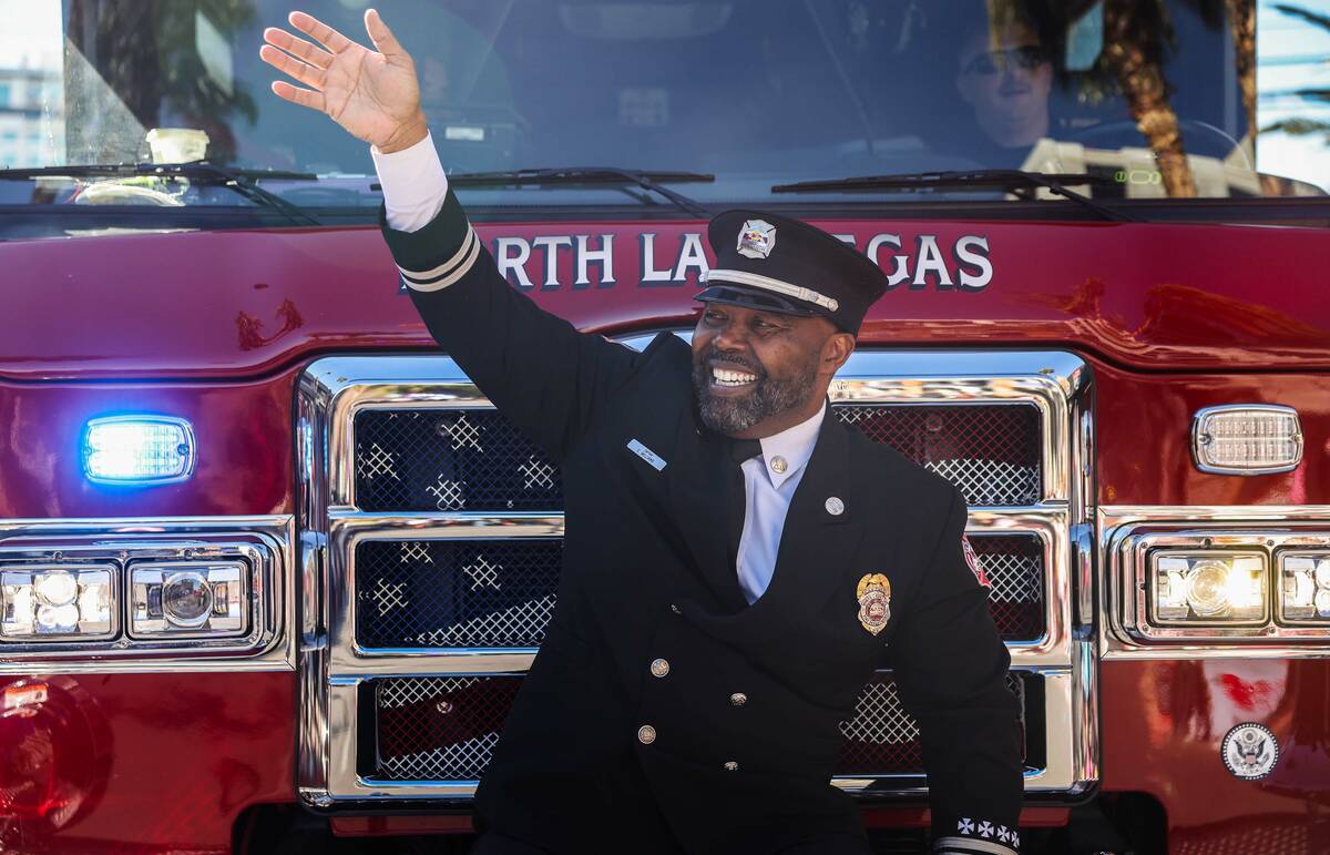 North Las Vegas Fire Department Capt. Cedric Williams waves to the crowd during the Dr. Martin ...