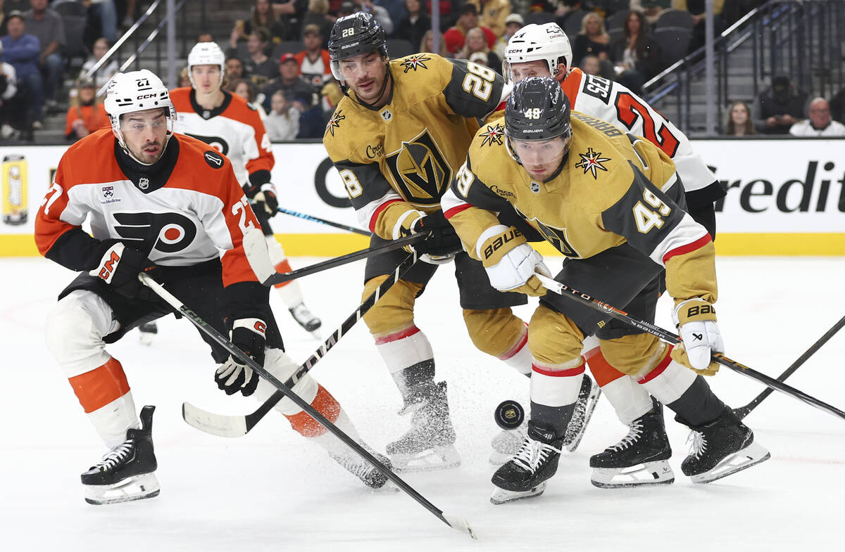 Golden Knights left wing Ivan Barbashev (49), center Tanner Laczynski (28) and Philadelphia Fly ...