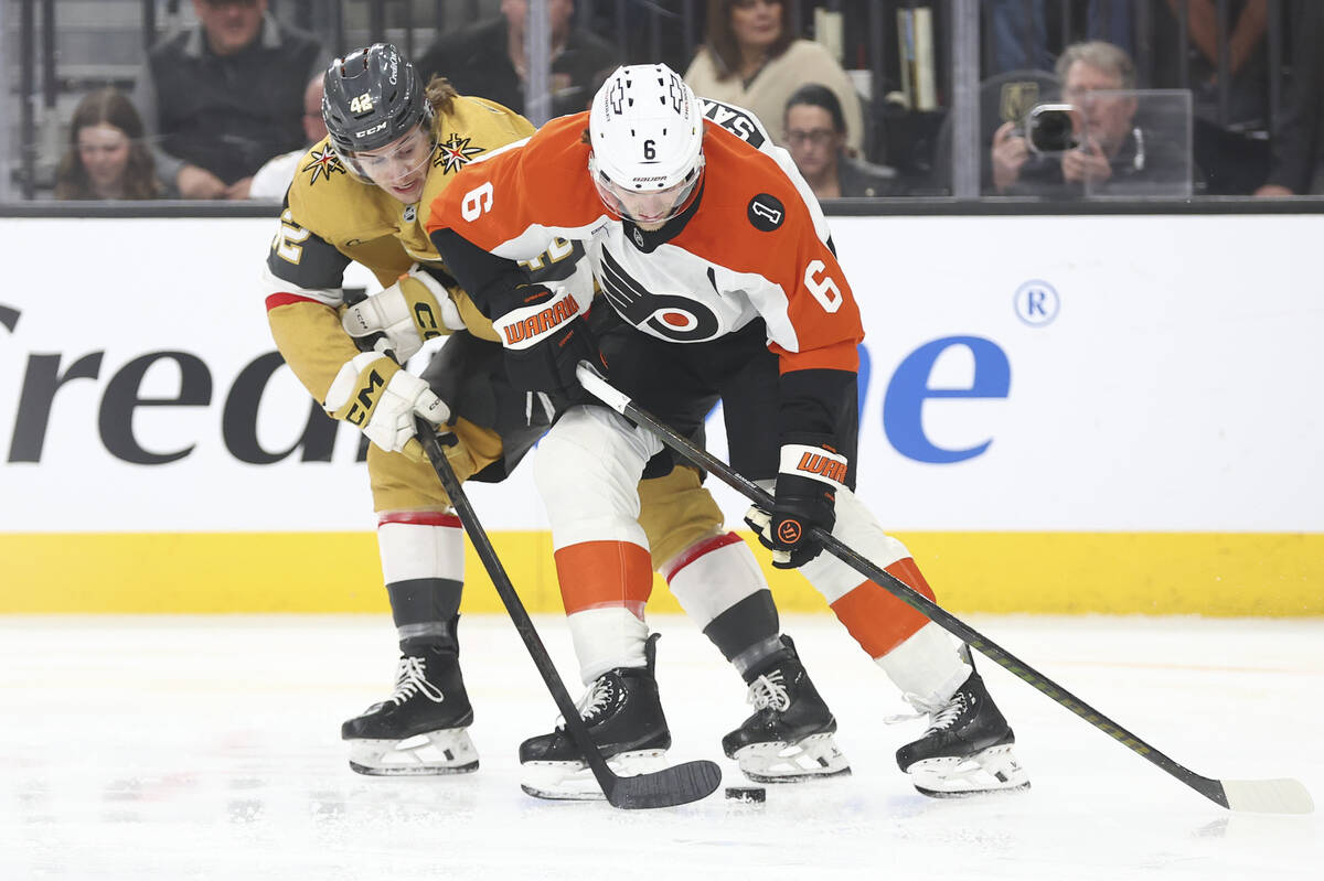 Golden Knights right wing Braeden Bowman (42) tries to get the puck from Philadelphia Flyers de ...
