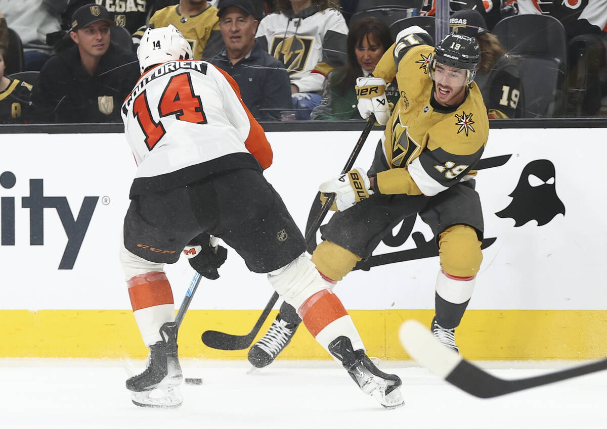 Golden Knights right wing Reilly Smith (19) looks to pass the puck under pressure from Philadel ...