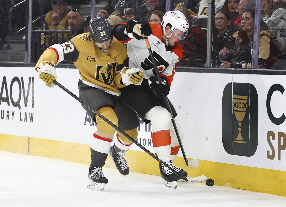 Philadelphia Flyers defenseman Nick Seeler (24) and Golden Knights left wing Cole Reinhardt (23 ...