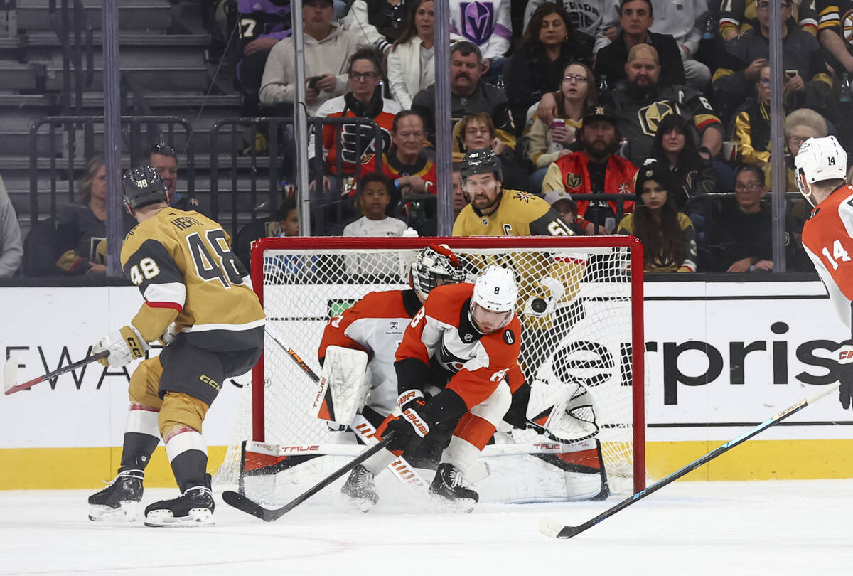Golden Knights center Tomas Hertl (48) scores past Philadelphia Flyers defenseman Cam York (8) ...