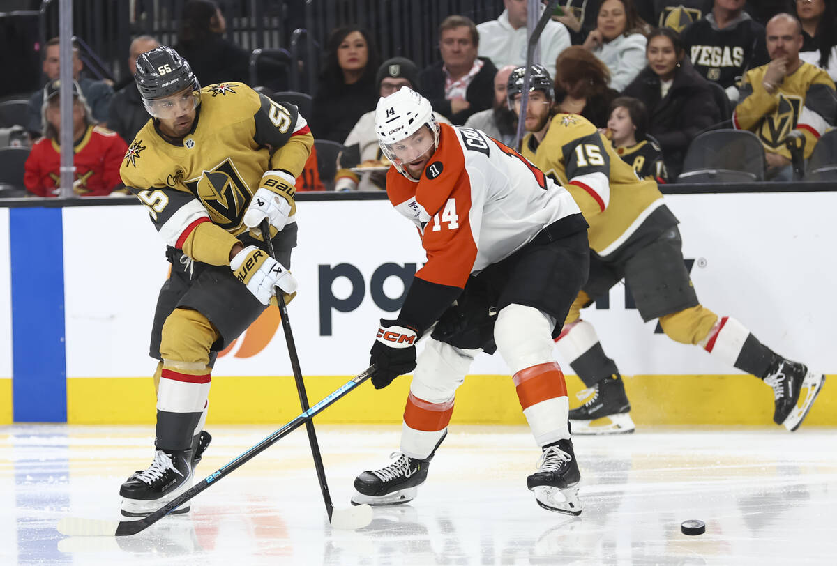 Golden Knights right wing Keegan Kolesar (55) shoots the puck past Philadelphia Flyers center S ...