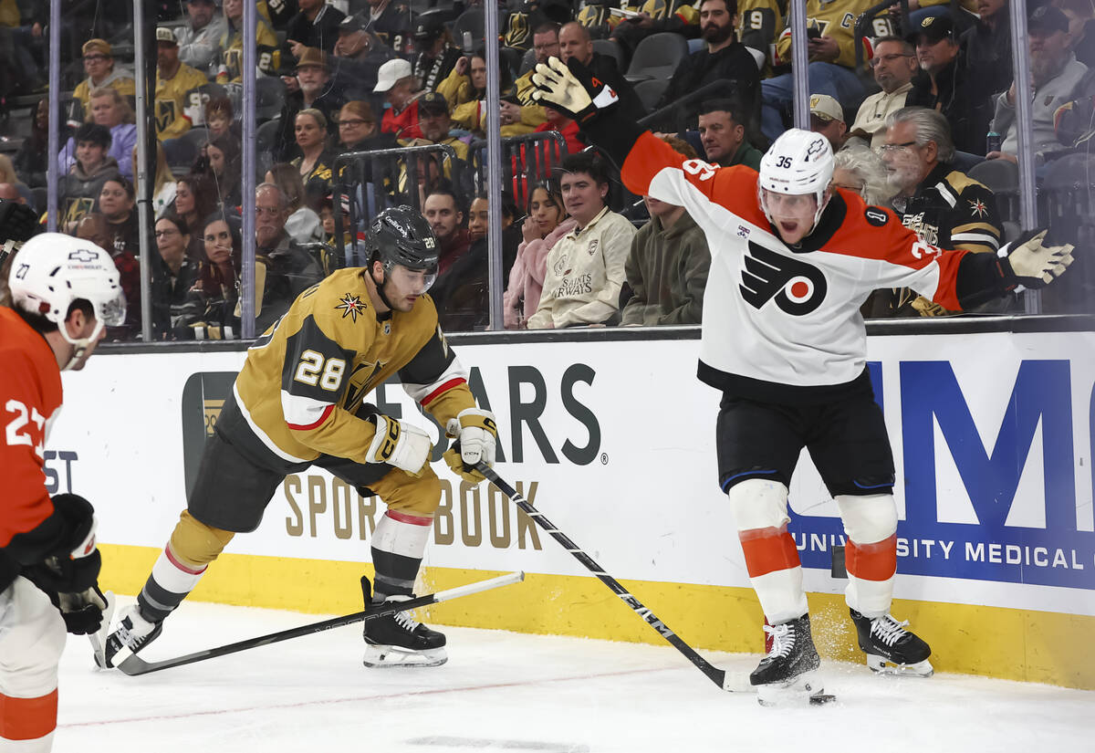 Philadelphia Flyers defenseman Emil Andrae (36) tries to defend after losing his stick while Go ...
