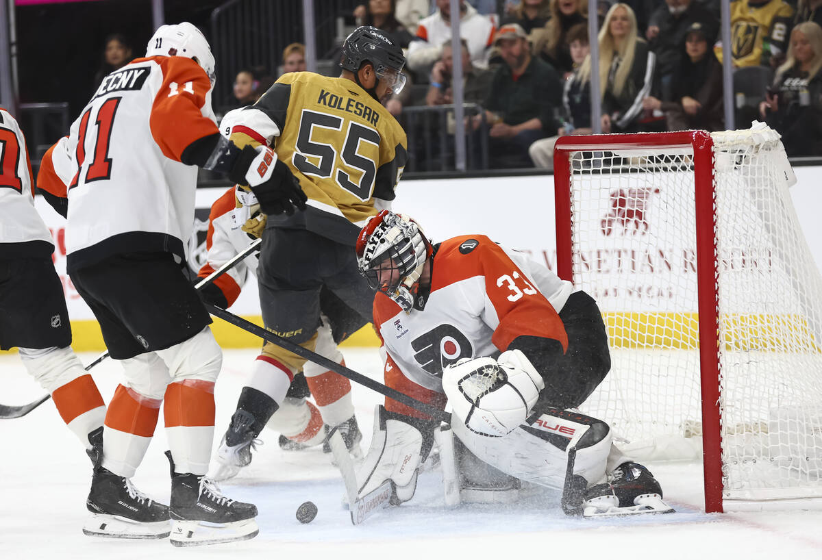 Philadelphia Flyers goaltender Samuel Ersson (33) blocks the puck in front of Golden Knights ri ...