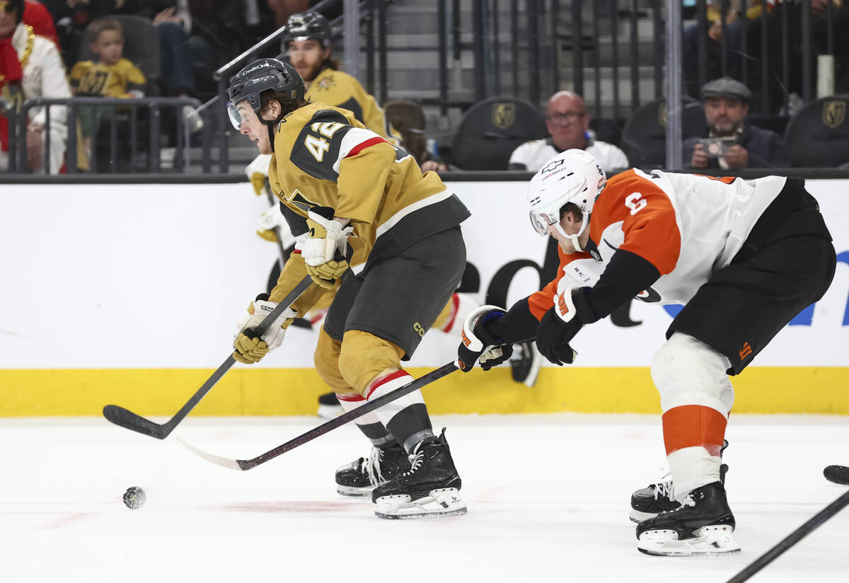 Golden Knights right wing Braeden Bowman (42) skates with the puck under pressure from Philadel ...