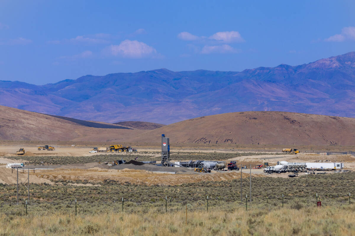 Construction vehicles and personnel work the land at the Thacker Pass mine construction site on ...