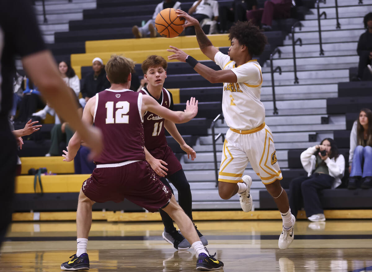 Clark's Sir Montgomery (2) passes the ball over Faith Lutheran's Jackson Klein (11) d ...