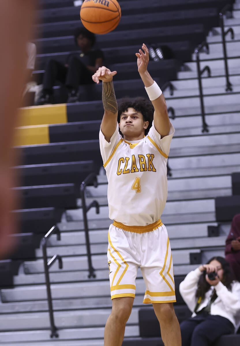 Clark's Kingston Young (4) shoots against Faith Lutheran during a basketball game at Clark ...