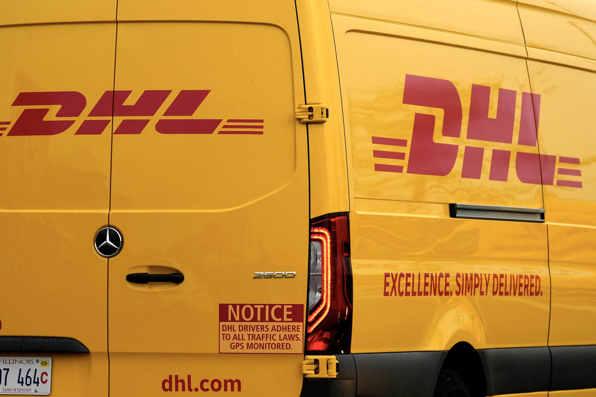 DHL logos are seen on the back of a company truck in Glenview, Ill., Thursday, May 2, 2024. (AP ...