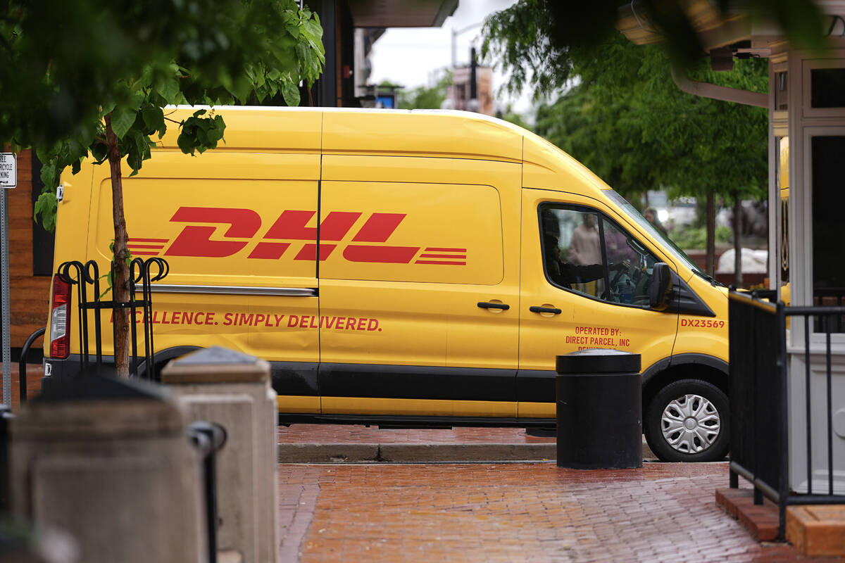 A DHL delivery van Tuesday, June 3, 2025, in Boulder, Colo. (AP Photo/David Zalubowski)