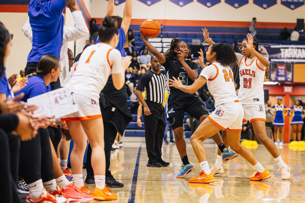 Democracy Prep point guard Bray'ana Miles (3) is cornered by Bishop Gorman defense during ...