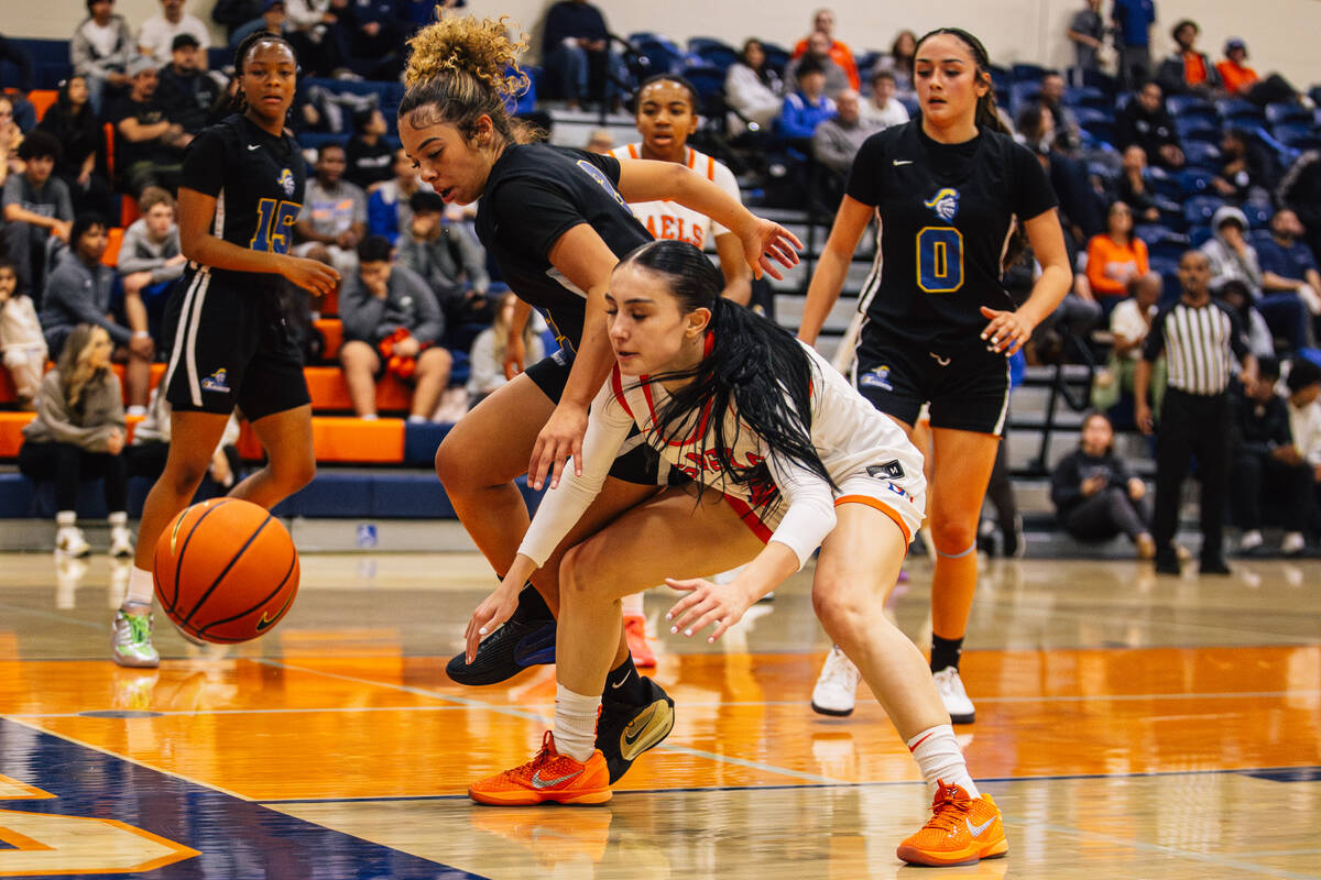 Democracy Prep guard Aryana Edwards (2) and Bishop Gorman point guard Kenzee Holton (14) chase ...