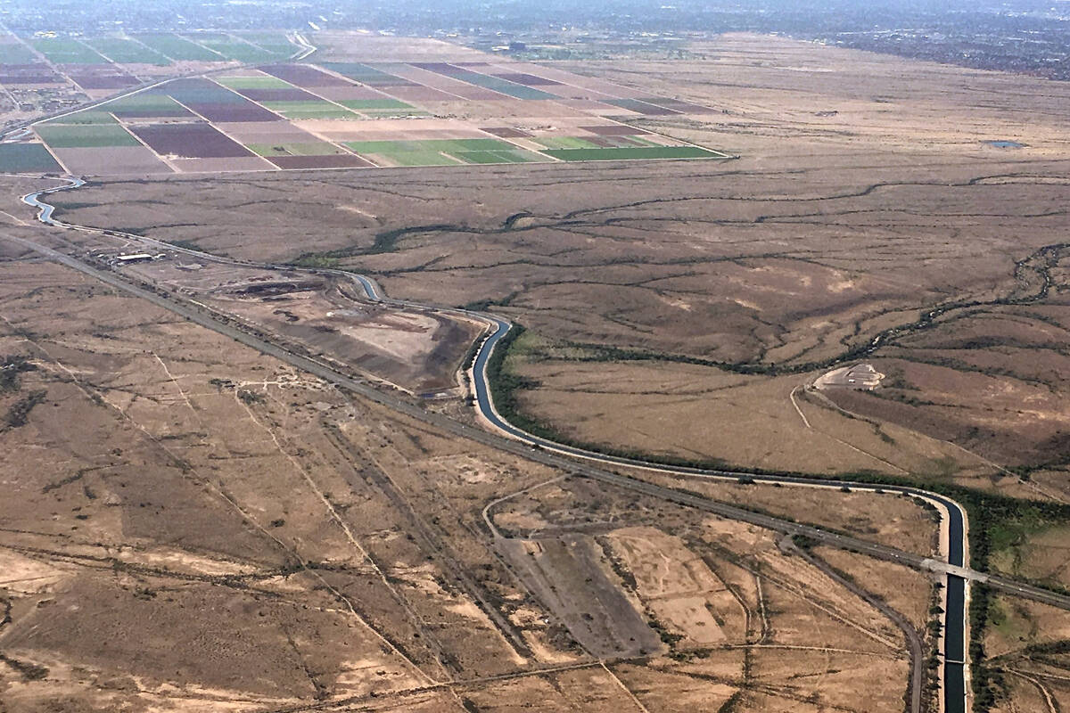 In this Oct. 8, 2019, file photo, the Central Arizona Project canal runs through rural desert n ...