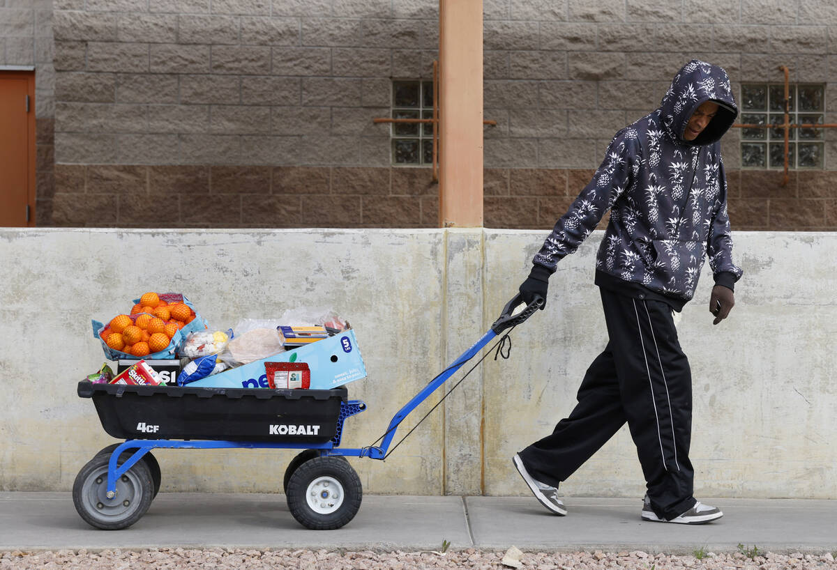 Allan Spaulding picks up food pantry items at Catholic Charities of Southern Nevada on Wednesda ...