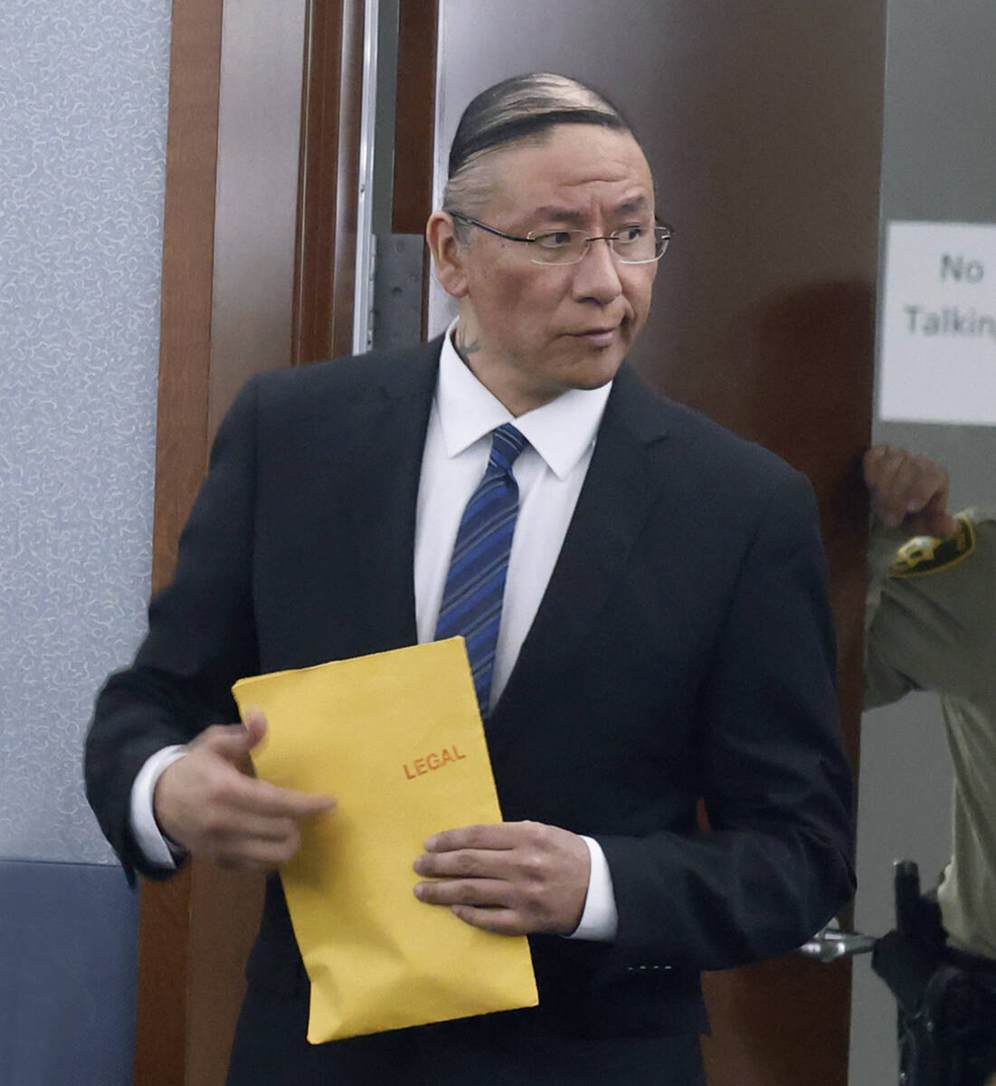 Nathan Chasing Horse is led into a courtroom for his trial on charges of sexually abusing Indig ...