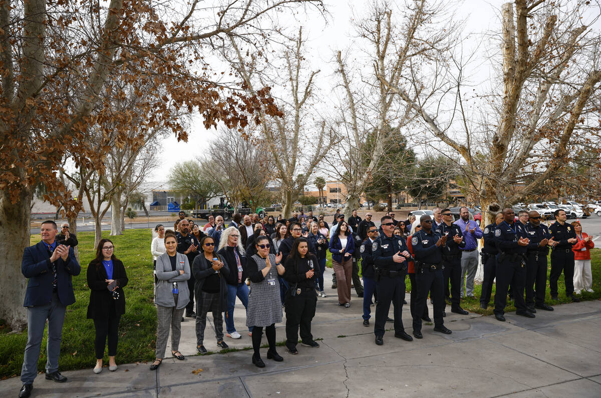 North Las Vegas city officials and employees clap during an event to kick off the demolition of ...