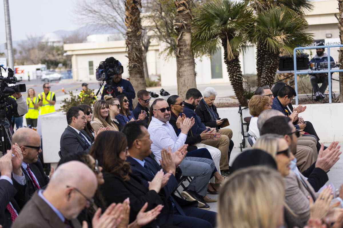 Attendees clap during an event to kick off the demolition of the old city hall complex on Wedne ...