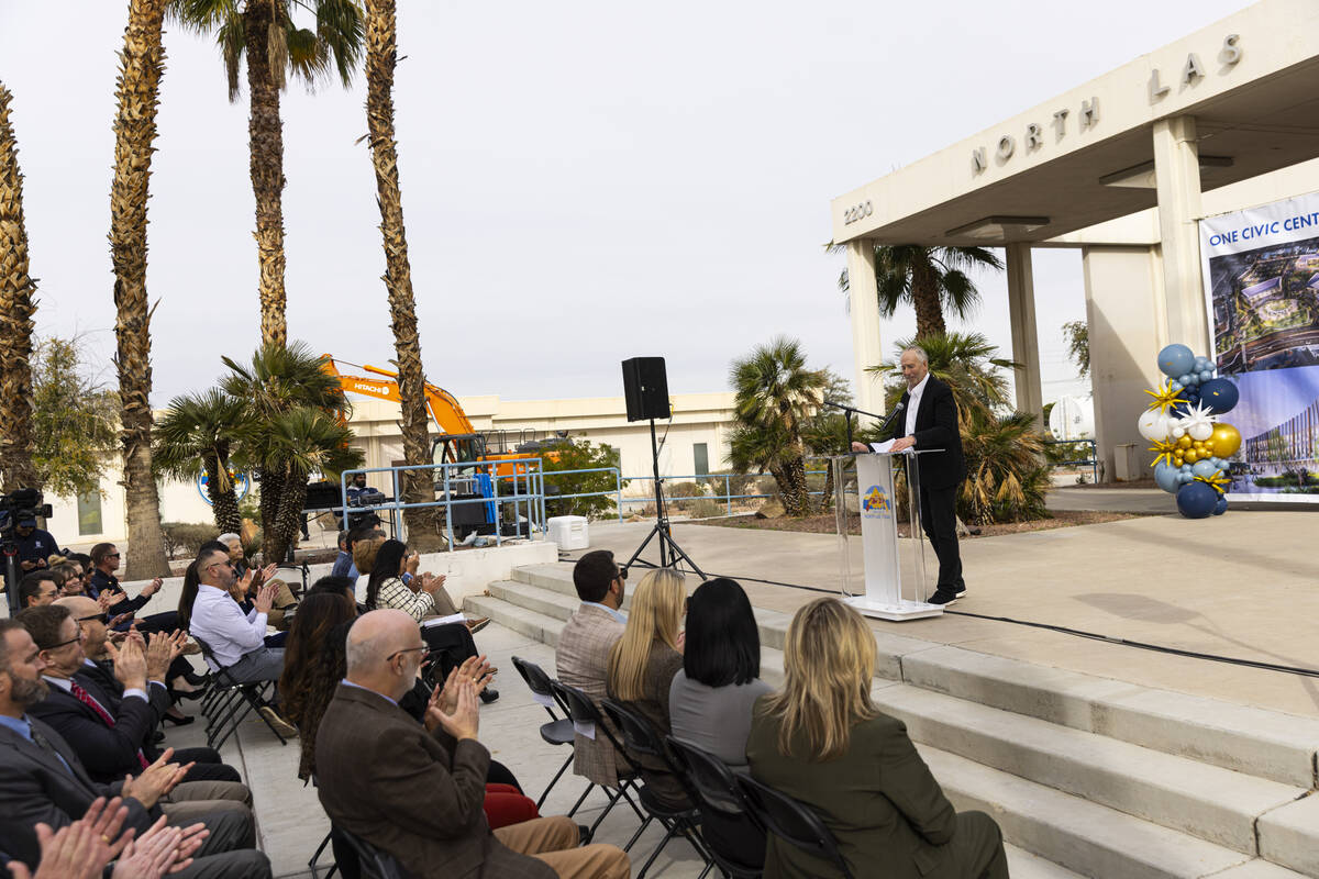 Attendees clap as Cary Lefton, CEO of Agora Realty and Management, speaks during an event to ki ...