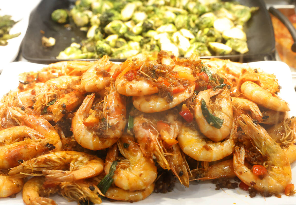 Hing Kong style spicy crispy garlic shrimps are displayed at In-Store Asian Gourmet Kitchen at ...