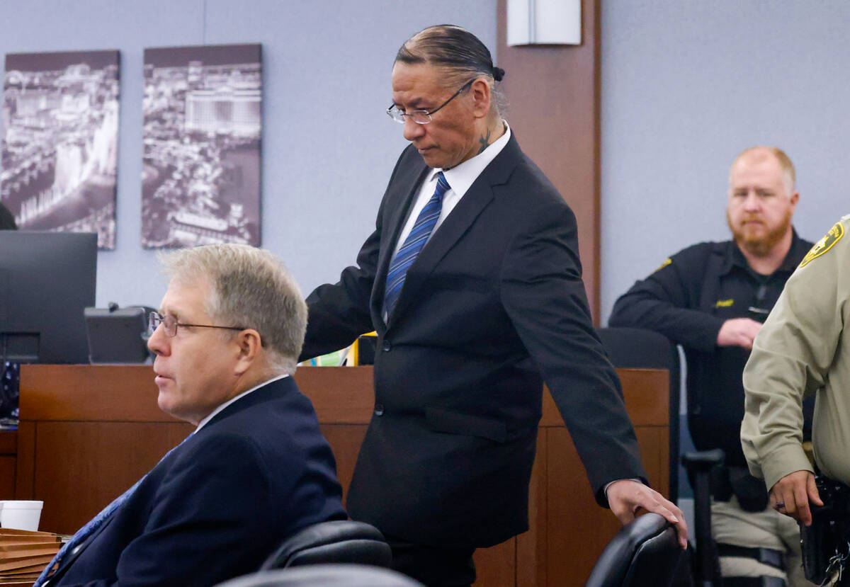 Nathan Chasing Horse, center, takes his seat as he appears in court with his attorney Craig Mue ...