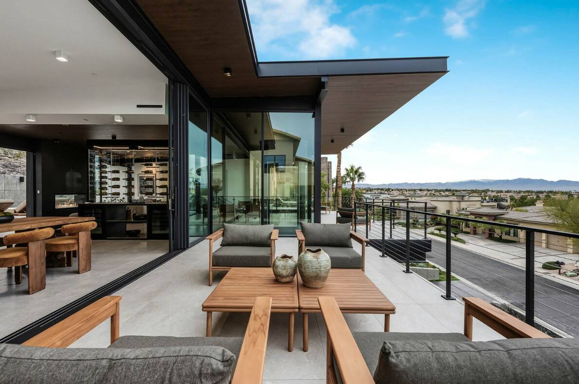 Located in MacDonald Highlands at 1707 Tangiers Dr., this 6,926 square foot, five bed and eight ...