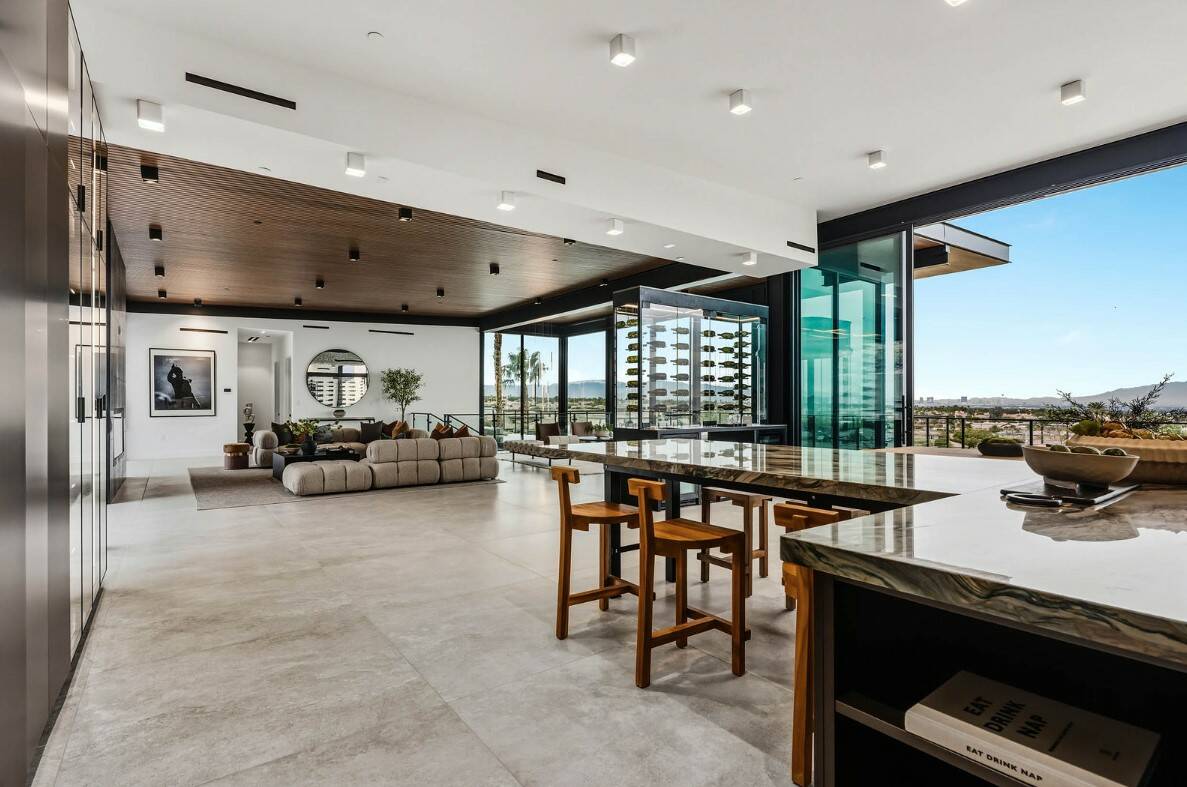 Located in MacDonald Highlands at 1707 Tangiers Dr., this 6,926 square foot, five bed and eight ...