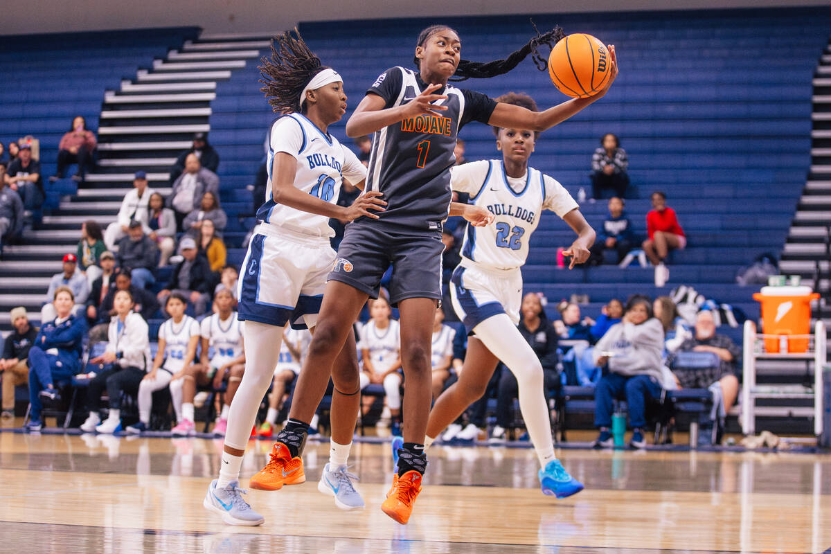 Mojave’ A'yanna Johnson (1) grabs the ball during a girls basketball game against ...